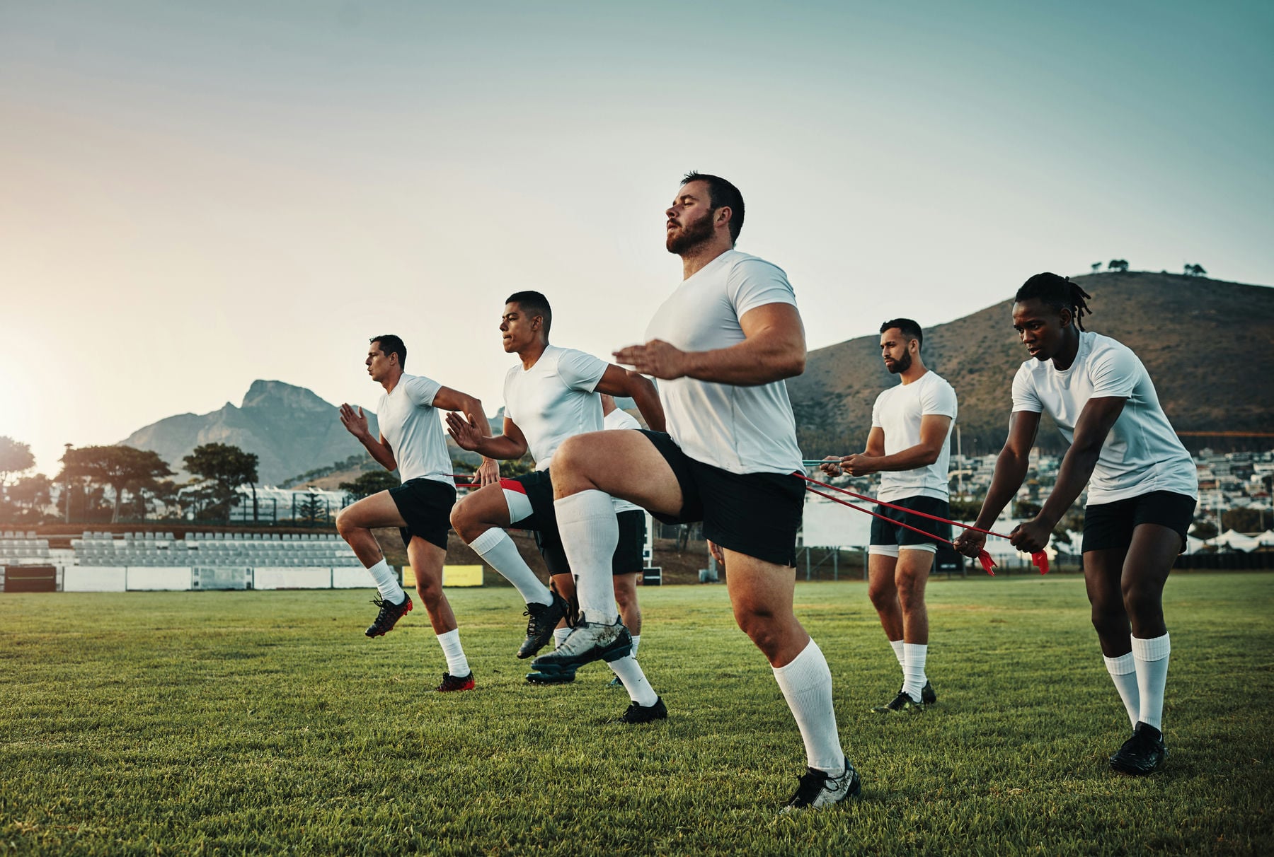 full-length-shot-of-a-group-of-young-rugby-players-2023-11-27-05-24-21-utc_min