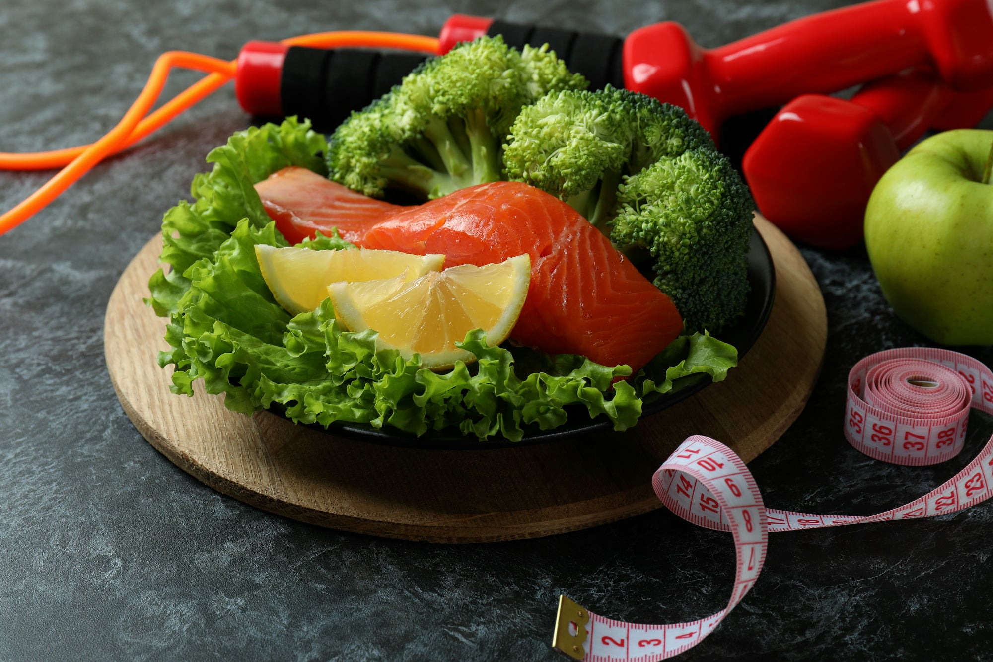 Healthy lifestyle accessories on black smokey table